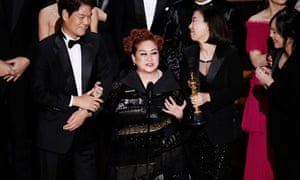 ‘I love the way he talks, the way he walks’ … Parasite producer Miky Lee on stage at the Academy Awards.