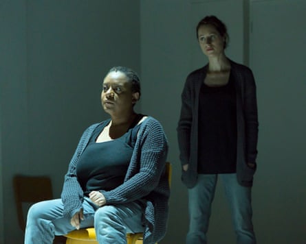 Gweneth Ann Rand is sitting in a chair with Susanna Hurrell standing behind her