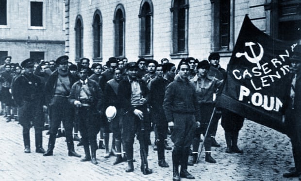 The Poum militia in Barcelona 1936 with Orwell in the background; he describes several days and nights spent defending its headquarters from the roof of the nearby Poliorama theatre in 1937. 