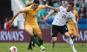 Australia’s Tom Rogic holds off Sebastian Rudy of Germany
