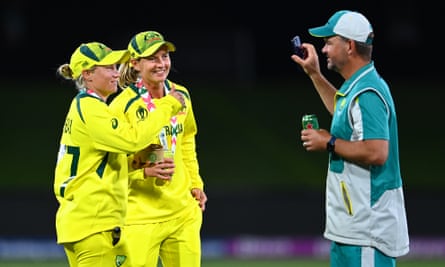 Matthew Mott celebrates with Australia’s captain, Meg Lanning, and the wicketkeeper Alyssa Healy after beating England in the World Cup final.