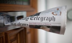 A copy of the Telegraph seen posted through a letterbox
