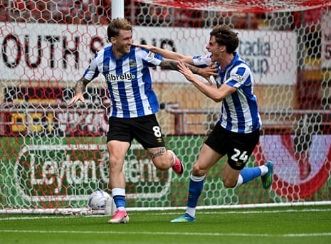 Callum Slattery (left) races away after scoring on his debut for Sheffield Wednesday.