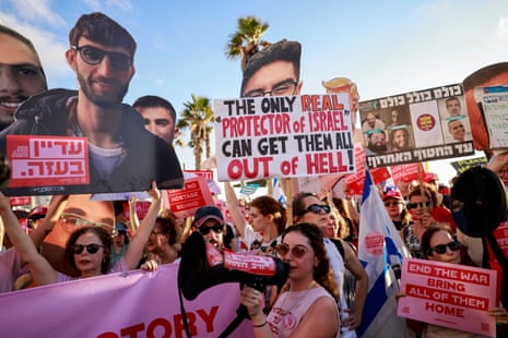 Activists hold portraits of Israeli hostages held in the Gaza Strip by Palestinian militants since the October 7, 2023 attacks, during a protest calling for their release and an end to the war, outside the the Branch Office of the Embassy of the United States of America in Tel Aviv on July 7, 2025. (Photo by Menahem Kahana / AFP) (Photo by MENAHEM KAHANA/AFP via Getty Images)