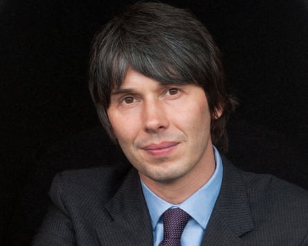 Head and shoulders shot of Brian Cox against dark background