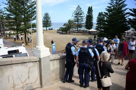 Police look out from the footbridge as Archer Park and the footbridge are reopened to the public at Bondi Beach in Sydney, Thursday, December 18, 2025.