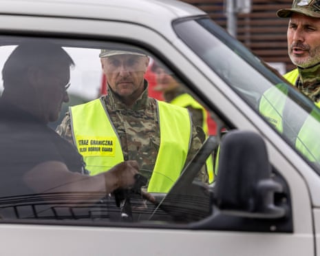 Polish border guards check the identity of drivers and their cars at the Polish-German border in Słubice, western Poland.