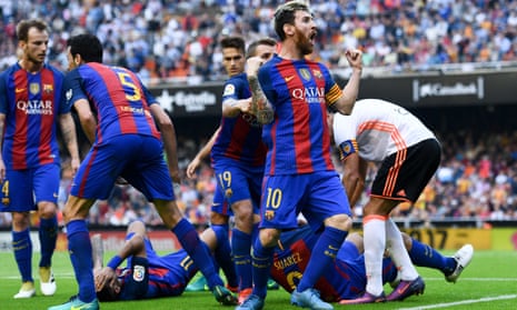 Lionel Messi celebrates his winning penalty as Neymar and Luis Suárez hit the deck