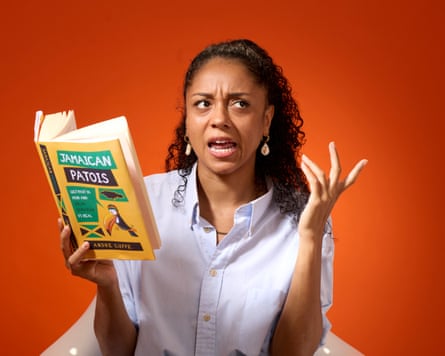Micha Frazer-Carroll expresses confusion while holding a book about Jamaican Patois.