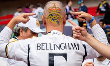 A Real Madrid fan shows off his special haircut