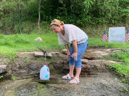 BarbiAnn Maynard, a citizen water advocate, collects spring water at the “Pool of Bethesda” in Mingo County, West Virginia. Maynard uses the water for drinking and cooking because she doesn’t trust Martin county’s tap water.