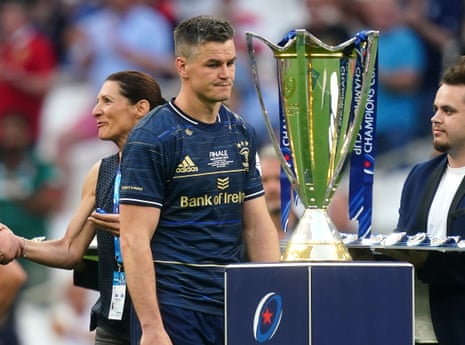 A dejected Johnny Sexton looks at the trophy following Leinster’s defeat against La Rochell.