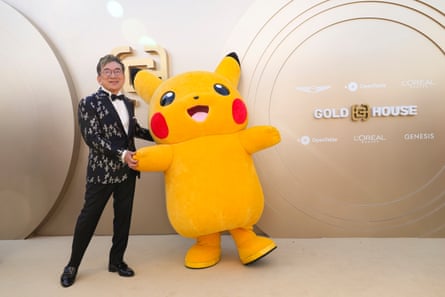 Pokemon creator Satoshi Tajiri with a lifesize Picachu