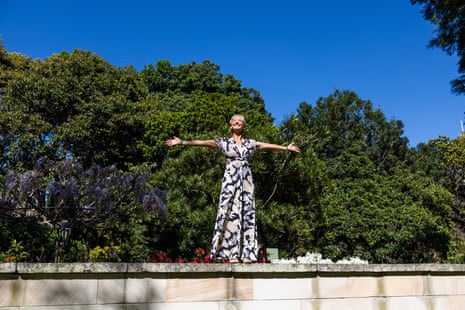 Beachley stands pinch her arms outstretched