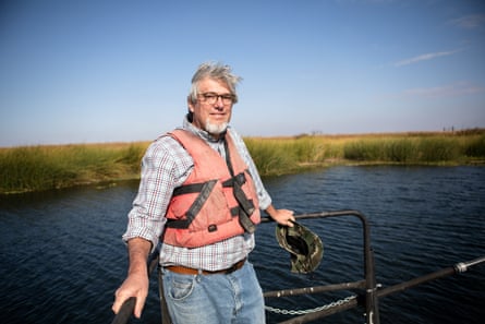 John Durand, a research scientist at the University of California, Davis, cruises the sloughs of California’s delta in search of Delta smelt.