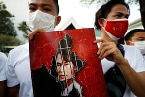Bangkok, Thailand: Myanmar citizens hold up a picture of leader Aung San Suu Kyi outside the United Nations building after the military seized power in a coup