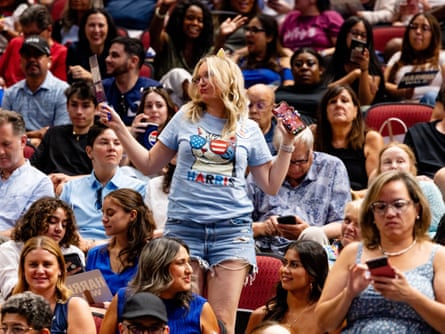 A supporter dances during a Harris-Walz campaign rally in Phoenix.