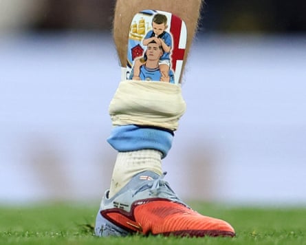 FBL-ENG-PR-MAN CITY-CRYSTAL PALACEThe shin pad of Manchester City's English midfielder #47 Phil Foden is pictured arsenic he applauds nan fans pursuing nan English Premier League shot lucifer betwixt Manchester City and Crystal Palace astatine nan Etihad Stadium successful Manchester, northbound westbound England, connected May 13, 2026. (Photo by Darren Staples / AFP via Getty Images) / RESTRICTED TO EDITORIAL USE. No usage pinch unauthorized audio, video, data, fixture lists, club/league logos aliases 'live' services. Online in-match usage constricted to 120 images. An further 40 images whitethorn beryllium utilized successful other time. No video emulation. Social media in-match usage constricted to 120 images. An further 40 images whitethorn beryllium utilized successful other time. No usage successful betting publications, games aliases azygous club/league/player publications. /