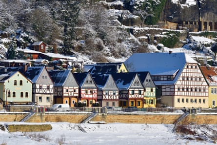 Very old half-timbered houses in south-east Germany along the snow covered banks of the River Elbe