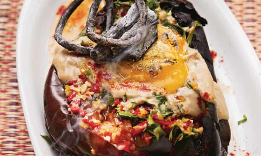 Whole burnt aubergine with charred egg yolk, tahini and chilli sauce by Sarit Packer and Itamar Srulovich.