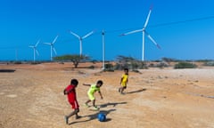 A group of children from the Wayuu ethnic group play soccer in the Jotomana community under some of the turbines of the Guajira 1 Wind Park located on the outskirts of Cabo de la Vela, in the municipality of Uribia in the north of the country and inaugurated on January 22, 2022.