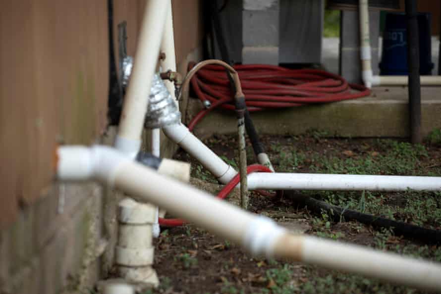 A series of pipes direct water from Aide Barrera’s kitchen sink and washing machine into her back yard, in order to bypass her faulty septic tank.