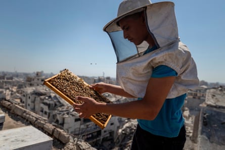 Musa, wearing protective headgear, hold a frame