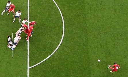 Denmark’s forward Mikkel Damsgaard (right) takes a free-kick and scores his team’s first goal during the EURO 2020 semi-final football against England.
