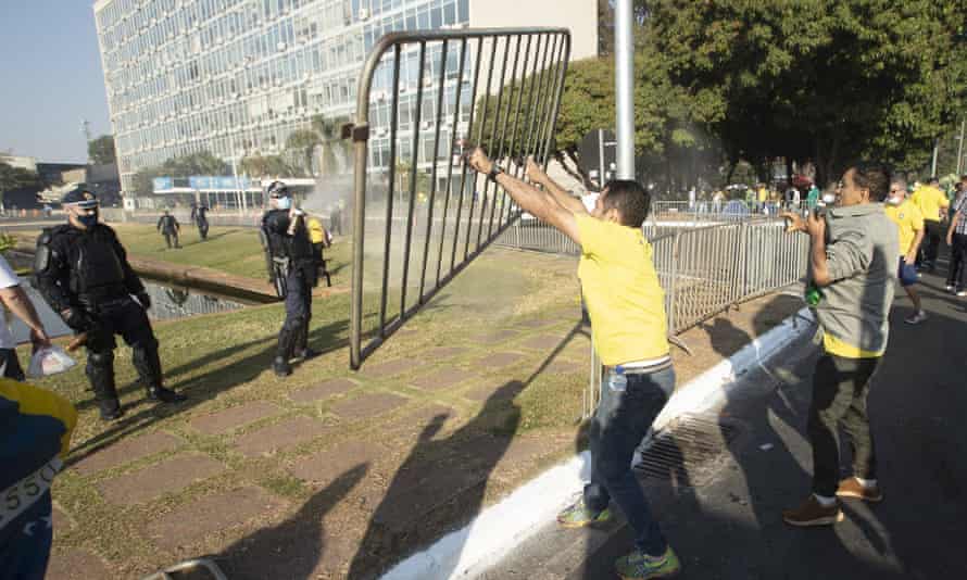 Supporters of Jair Bolsonaro clash with police.