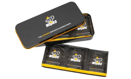A tin of Crep Protect trainer wipes slightly opened with one strip of wipes next to the tin