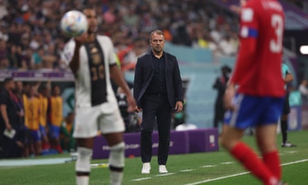 Hansi Flick watches on the touchline as Germany take a throw-in against Costa Rica.