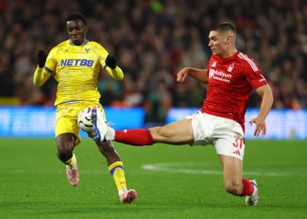 Crystal Palace’s Eddie Nketiah is tackled by Nottingham Forest’s Nikola Milenkovic