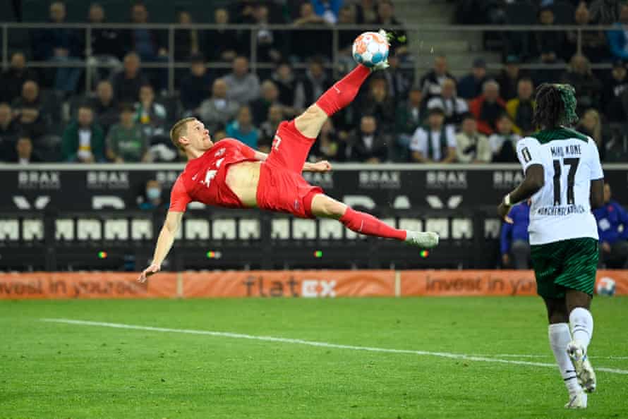 RB Leipzig on verge of glory but still a long way from national acceptance | Bundesliga 1 Leipzig’s German defender Marcel Halstenberg clears the ball in acrobatic fashion.
