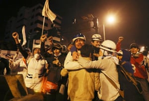 Protesters celebrate the announcement that the government cancelled an austerity package that triggered violent protests, in Quito, Ecuador, Sunday, Oct. 13, 2019. Ecuadorian President Lenin Moreno and leaders of the country’s indigenous peoples have struck a deal to cancel the disputed austerity package and end nearly two weeks of protests that have paralyzed the economy and left several people dead.