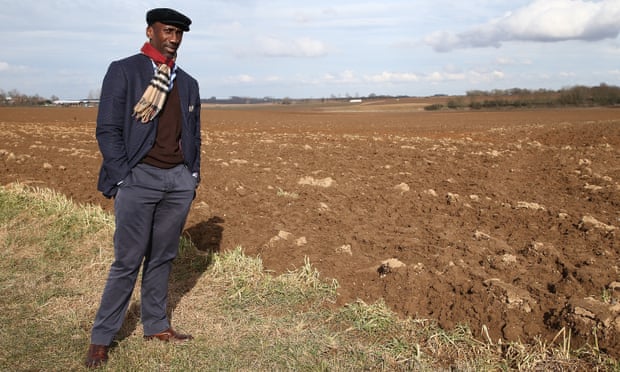 Jimmy Floyd Hasselbaink, then the Northampton manager, stands next to the field in Favreuil where Walter Tull was killed in March 1918.