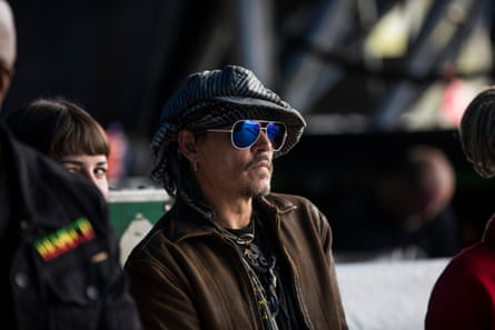 Johnny Depp watches Run The Jewels the Pyramid Stage. Glastonbury Festival. Photograph by David Levene 24/6/17