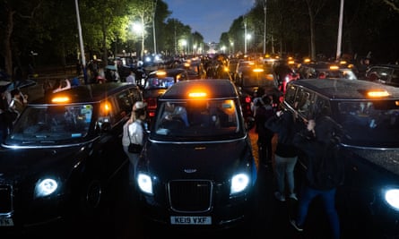 London black cabs line The Mall in front of leading up to Buckingham Palace.