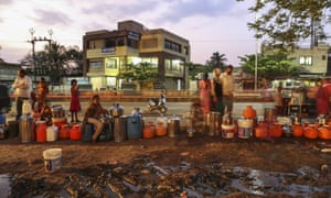 Water commuters wait in line to fill containers at the Vivekananda Chowk water tank in Latur, Maharashtra, India, on Saturday, April 16, 2016