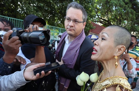 Theary Seng, right, a Cambodian American lawyer, speaks with media with Jared Genser, center, in Phnom Penh, Cambodia, in 2021.