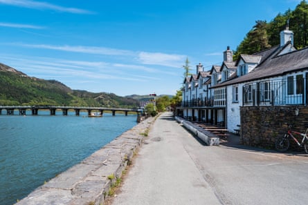 A pretty row of riverside houses and a toll bridge.