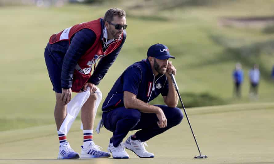 Dustin Johnson lines up his putt on the 11th in Saturday’s fourballs