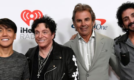 Neal Schon and Jonathan Cain (both centre), pictured at the 2021 iHeartRadio Music Festival in Las Vegas, Nevada.