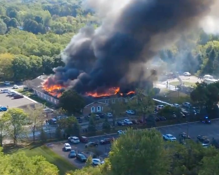 Drone footage shows church on fire after shooting in Michigan – video