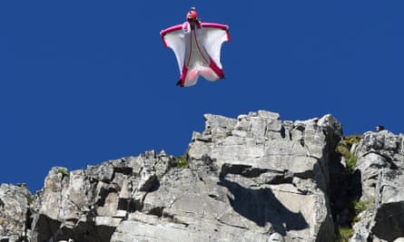 Switzerland’s Géraldine Fasnacht jumps from the top of the Brévent mountain to glide over the French resort of Chamonix.