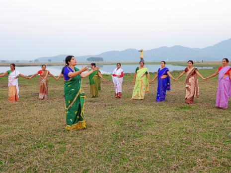 Barman and members of the 10,000-strong hargila army sing and dance to traditional songs.