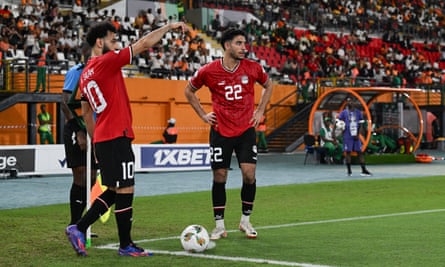Mohamed Salah gestures as Omar Marmoush reacts during the Africa Cup of Nations match between Egypt and Ghana.