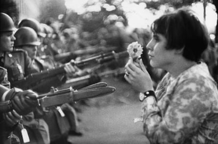 USA. Washington DC. 1967. An American young girl, Jan Rose KASMIR, holding a flower, confronts the American National Guard outside the Pentagon during the 1967 anti-Vietnam march.