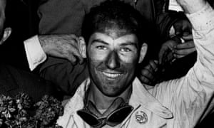 Stirling Moss celebrates winning the Mille Miglia in 1955.