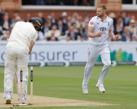 Gus Atkinson of England celebrates after dismissing Matt Henry at Lord’s