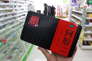 A customer shops for ejiao, or donkey-hide gelatin, at a pharmacy in Nantong, China.